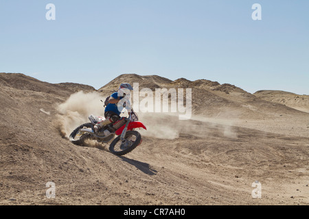USA, California, Motocrosser performing power slide on Palm Desert Stock Photo