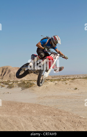 USA, California, Motocrosser jumping on Palm Desert Stock Photo