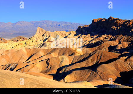 Coloured rock formations at sunrise, Zabriskie Point, Death Valley National Park, California, USA Stock Photo
