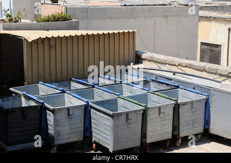 Metal garbage containers and dumpsters at an incinerator in a thermal treatment facility. Stock Photo