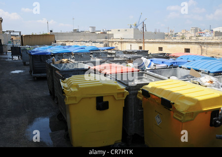 Metal garbage containers and dumpsters at an incinerator in a thermal treatment facility. Stock Photo