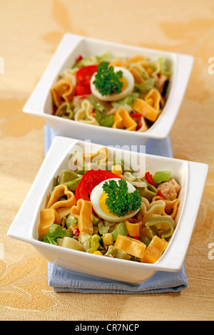 Heart shaped pasta in salad. Recipe available Stock Photo