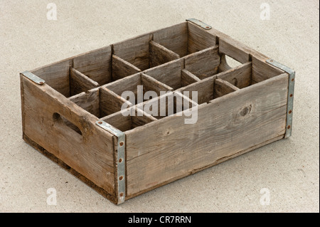 Old empty wood bottle crate or box with 12 divisions and hand grips. Stock Photo