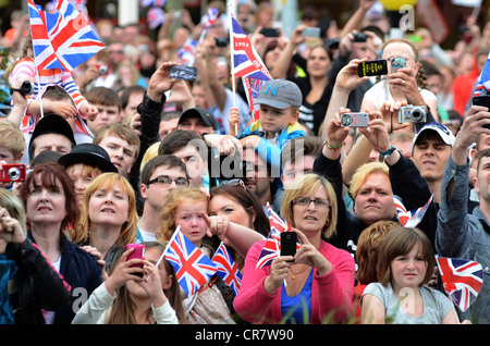 Crowd in George Street watching her Majesty the Queen visiting Corby, Northamptonshire , 13th June, 2012. Stock Photo