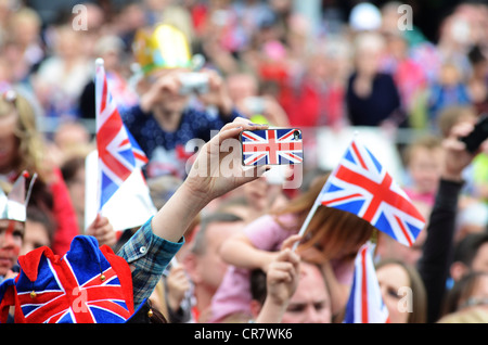 Crowd in George Street watching her Majesty the Queen visiting Corby, Northamptonshire , 13th June, 2012 Stock Photo
