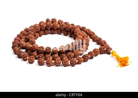 Buddhist or Hinduist Japa mala (prayer beads) made of rudraksha isolated Stock Photo