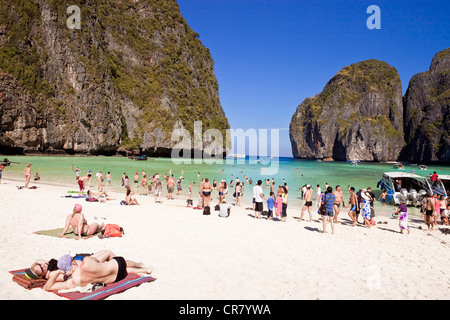 Thailand Phi Phi Leh island topless sunbathing tourists and boats on