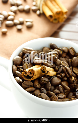 Coffee beans and Cinnamon Sticks in the cup Stock Photo