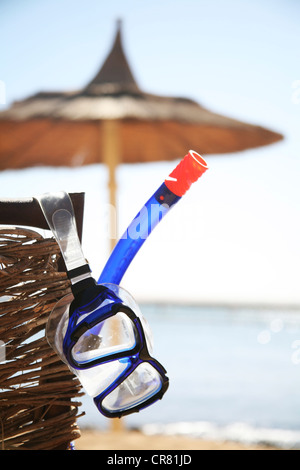 Diving goggles with a snorkel at the beach with a sunshade, Hurghada, Egypt, Red Sea, Africa Stock Photo