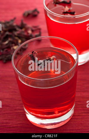Hibiscus herbal tea in glass cup Stock Photo