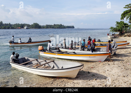 small boats ferries passengers between Buka Island (background) and Bougainville island (front), Papua New Guinea Stock Photo