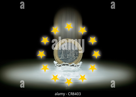 1-euro coin is sinking in water, EU-stars, symbolic image for euro crisis Stock Photo