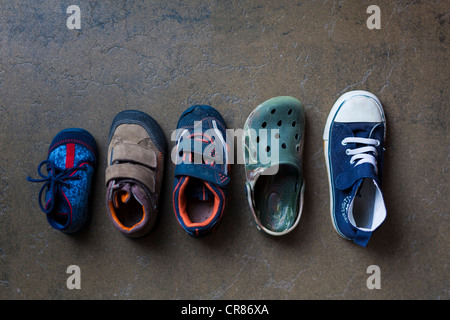 Children's shoes in various sizes from baby to kindergarten-age Stock Photo