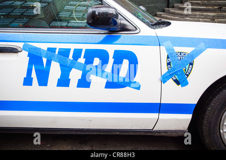 New York City Police Department cars with NYPD words and graphics taped over, at a TV taping in New York City. Stock Photo