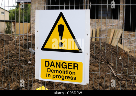 Danger demolition warning sign on building site Stock Photo