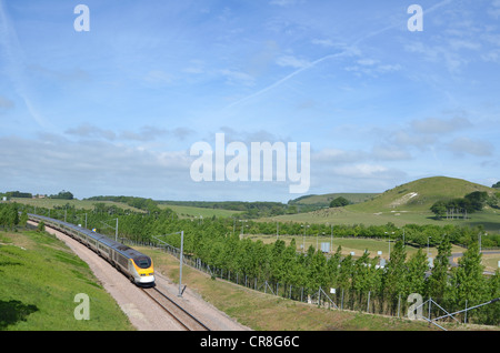 Eurostar passing the North Downs whilst approaching the Channel Tunnel terminal at Folkestone, Kent, UK Stock Photo