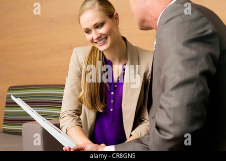 Estate agent meeting with client in office Stock Photo