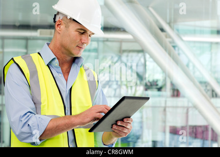 Engineer using digital tablet in office Stock Photo