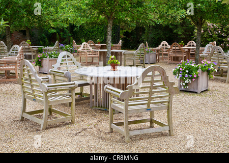 View of the outdoor seating on the gravel terrace of Littlecote Manor in Berkshire, England, UK Stock Photo