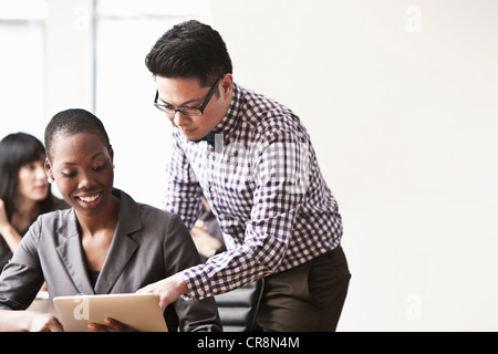 Businesspeople using digital tablet Stock Photo