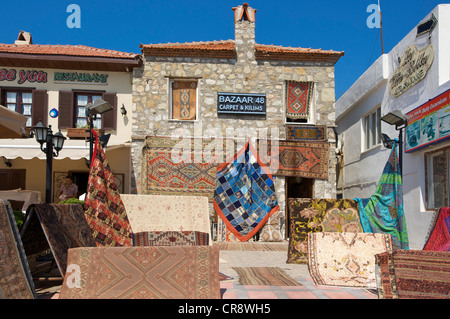 Carpets on sale at the harbour promenade in Marmaris, Turkish Aegean Coast, Turkey Stock Photo