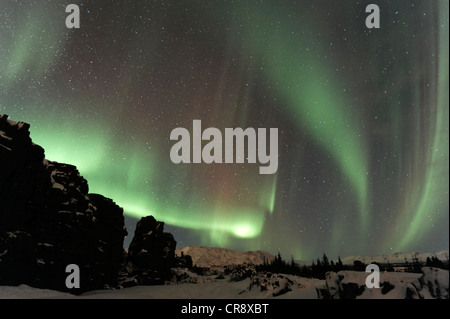 Northern Lights (Aurora borealis) over the canyons created by continental drift, Þingvellir, Iceland, Europe Stock Photo