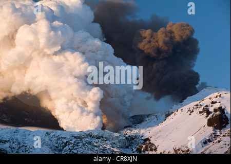 Cloud of ash from Eyjafjallajoekull volcano and a steam plume from the lava flow in Gigjoekull glacier tongue, Iceland, Europe Stock Photo