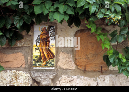 St. Francis, painted ceramic tiles on display, Assisi, Umbria, Italy, Europe Stock Photo