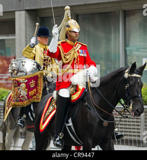 The band of the Household Cavalry ride to Westminster Hall to escort the Queen in a carriage procession Stock Photo