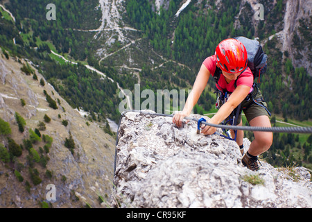 Climber on the Stevia fixed rope route in the Langental valley, Val Gardena valley, Dolomites, province of Bolzano-Bozen, Italy Stock Photo