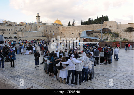 Dancing Jews in circles on the Sabbath, forecourt of the Wailing Wall, Arab Quarter in the old town of Jerusalem, Israel Stock Photo