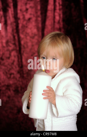 Little girl with a candle Stock Photo