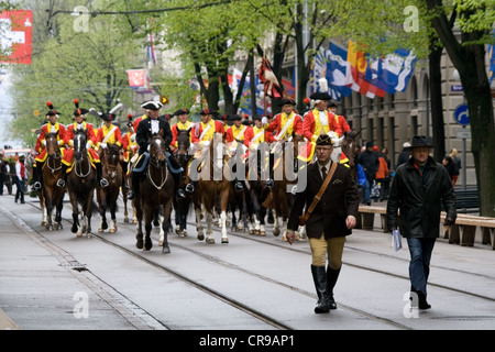 ZURICH - APRIL 16: Members of traditional annual spring parade of Guilds, ride along Bahnhofstrasse Stock Photo
