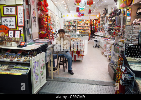 Stall-keeper in Stanley Market, Hong Kong 2 Stock Photo