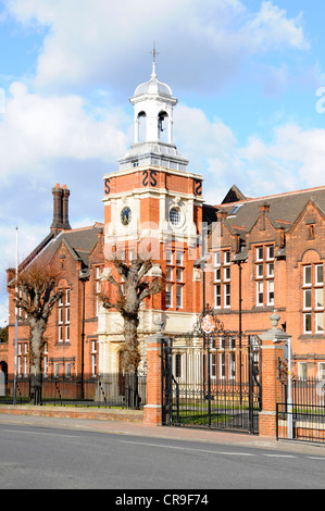 Gates & front of Brentwood School main brick building private independent day & boarding school education with clock tower in Brentwood, Essex England Stock Photo