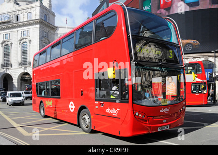 Hybrid London bus operated by Abellio company owned by Nederlandse Spoorwegen crossing box junction at Piccadilly Circus West End London England UK Stock Photo