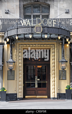 Entrance canopy doors with sign above on the historic Waldorf Hilton London hotel in winter at Aldwych London England UK Stock Photo