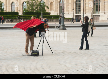 Paris, France - A man using a large format camera outdoors Stock Photo