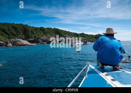 Man on the boat at diving spot near Similan islands in Thailand Stock Photo