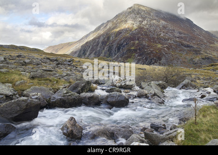 The Afon (River) Idwal flows down towards Llyn Ogwen, with Pen Yr Ole Wen, Wales' 7th highest peak, in the background. Stock Photo