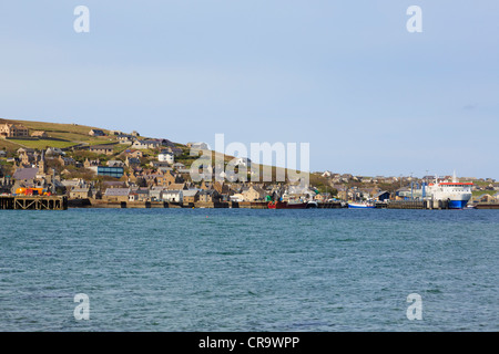 Stromness Orkney Islands Scotland UK. View of town and port from across harbour with Northlink ferry to Scrabster in dock