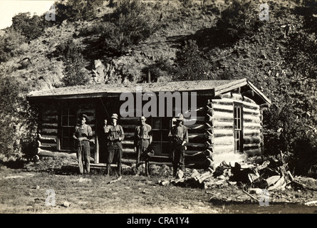 Four Fishermen at Wilderness Log Cabin Stock Photo