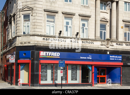 BetFred betting shop on Chapel Street ,Salford in a building formerly occupied by the 'Manchester MIDI school' Stock Photo