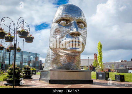 THe statue by Rick Kirby entitled the Face of Wigan in the Wiend in the town centre. Stock Photo
