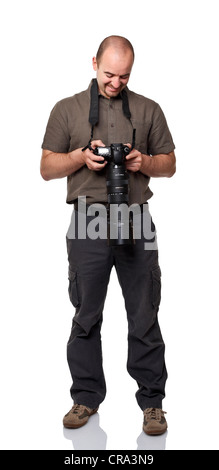 smiling man look his picture on digital camera Stock Photo