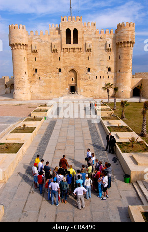 Tourists in front of the Qaitbay fortress, Alexandria, Egypt, Africa Stock Photo
