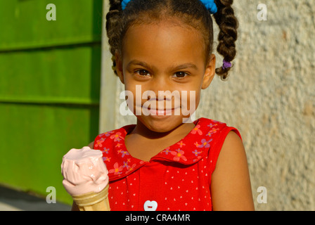 Girl eating an ice cream cone, Havana, Cuba, Caribbean Stock Photo