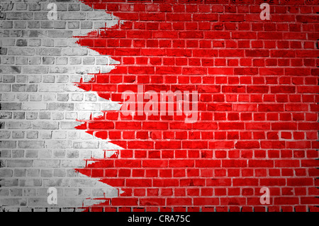 An image of the Bahrain flag painted on a brick wall in an urban location Stock Photo