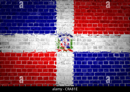 An image of the Dominican Republic flag painted on a brick wall in an urban location Stock Photo