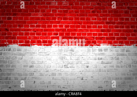 An image of the Indonesia flag painted on a brick wall in an urban location Stock Photo